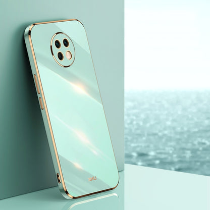 Mint green electroplate TPU phone case with gold trim and camera cutouts
