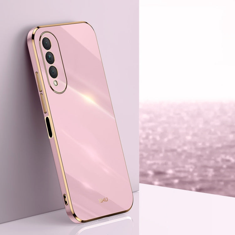 Pink electroplated TPU phone case with gold trim, raised camera cutouts and button covers