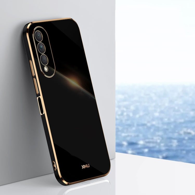 Black electroplated TPU phone case with gold trim, raised camera cutouts and button covers
