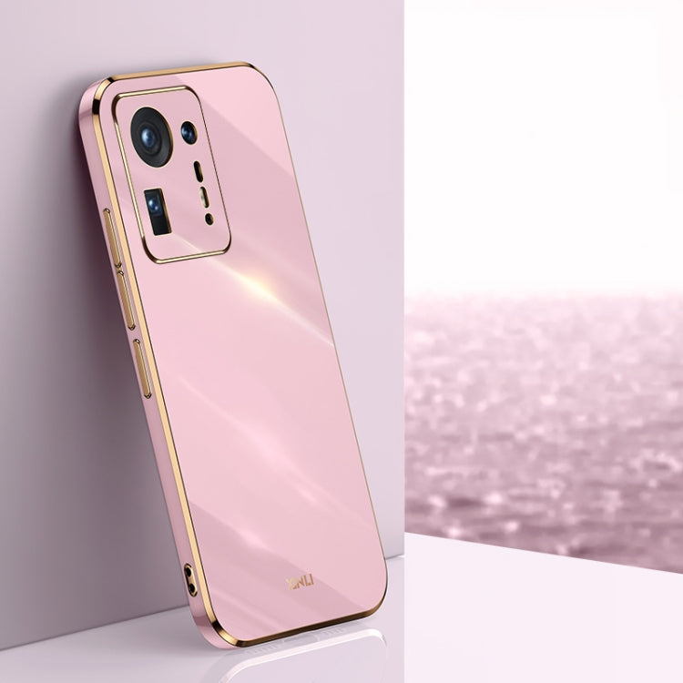 Pink electroplated TPU phone case with gold trim, raised camera cutouts and side button access