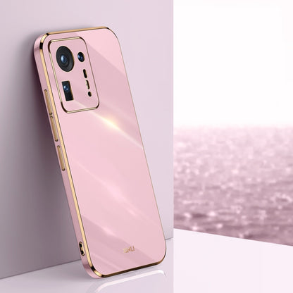 Pink electroplated TPU phone case with gold trim, raised camera cutouts and side button access