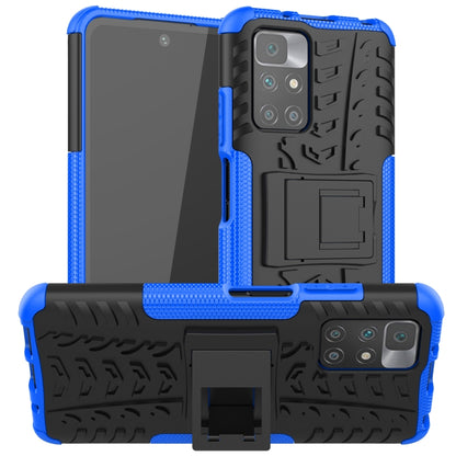 Blue shockproof protective case with textured tire grip, camera cutout, and built-in holder