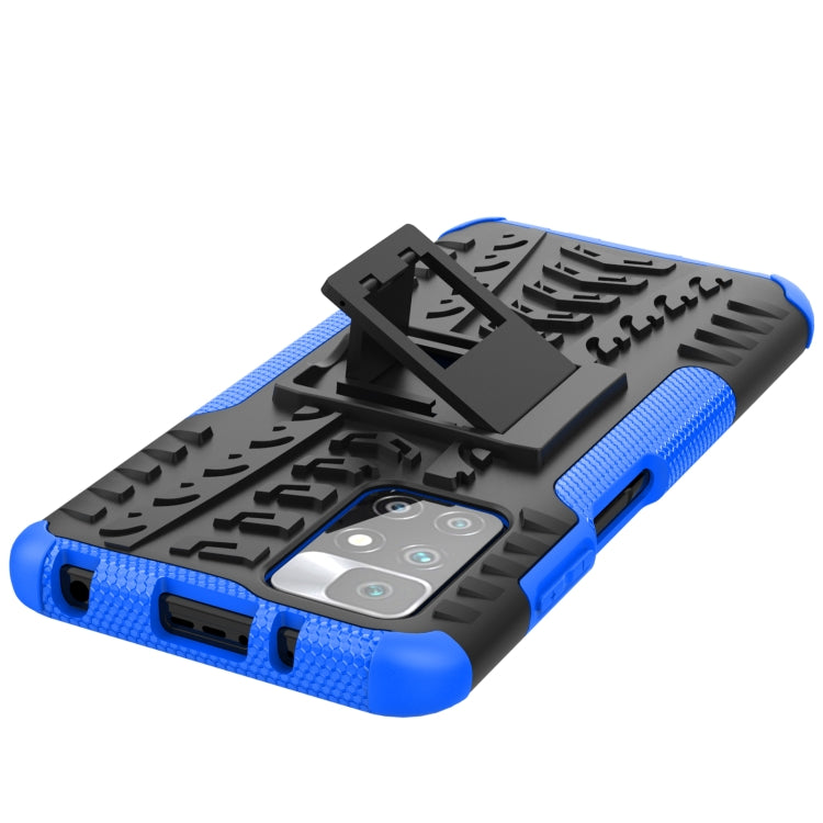 Blue and black shockproof case with tire texture, port cutouts, and stand holder