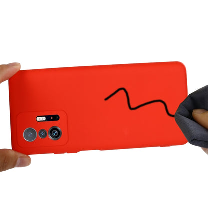 Red liquid silicone phone case close-up showing camera module openings