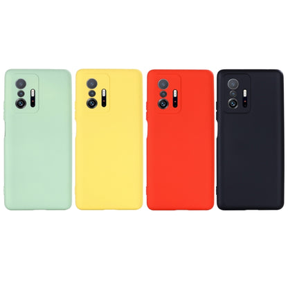 Set of four liquid silicone phone cases in mint, yellow, red, and black