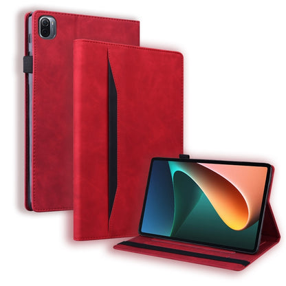 Red shockproof leather folio case with kickstand and front cover, tablet angled view.