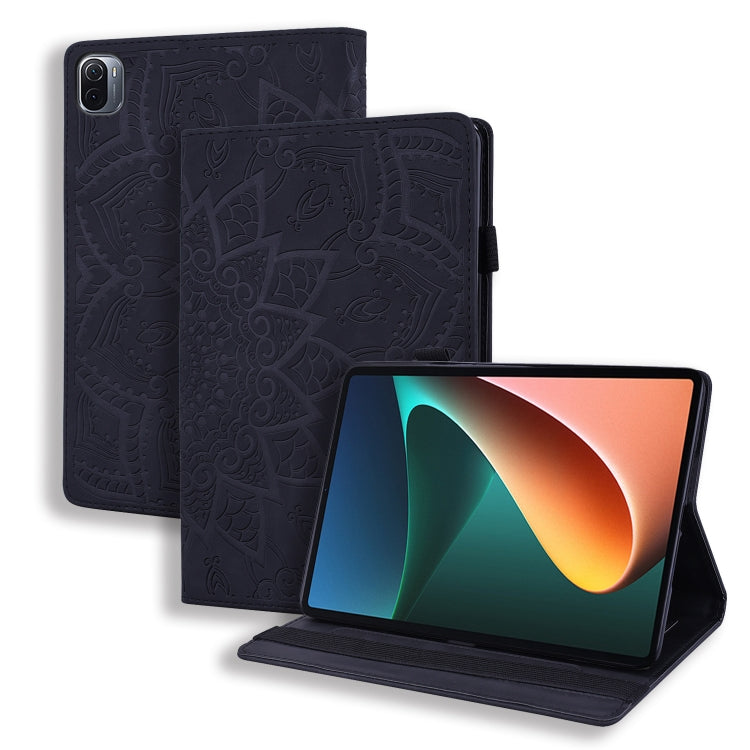 Embossed leather folio case with stand for tablet; black patterned cover and elastic strap
