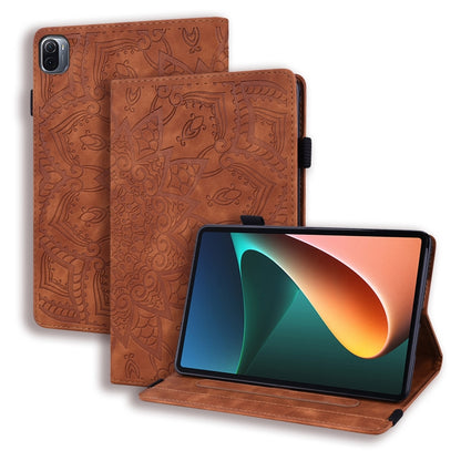 Brown embossed leather folio case with stand; patterned cover and elastic strap