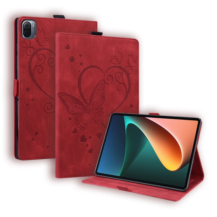 Red leather tablet flip case with embossed butterfly-heart pattern and front stand