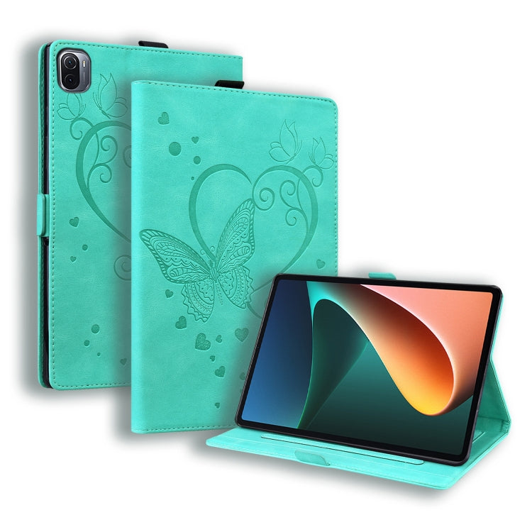 Mint green leather tablet flip case with embossed butterfly-heart pattern and stand