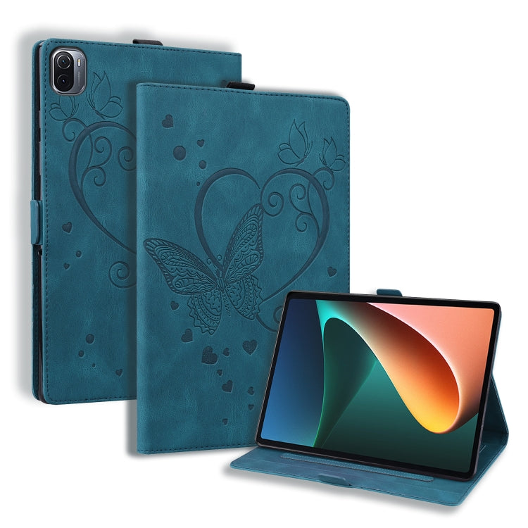 Blue leather tablet flip case with embossed butterfly-heart pattern and front stand