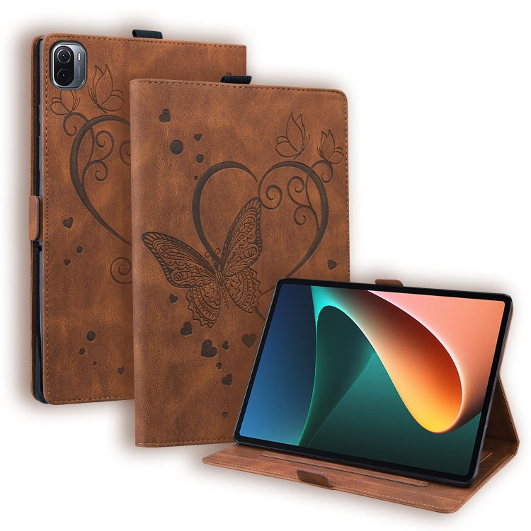 Brown leather tablet case with butterfly pattern, flip cover, and built-in stand