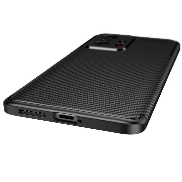 Black TPU phone case with carbon fiber texture, bottom ports and speaker cutout