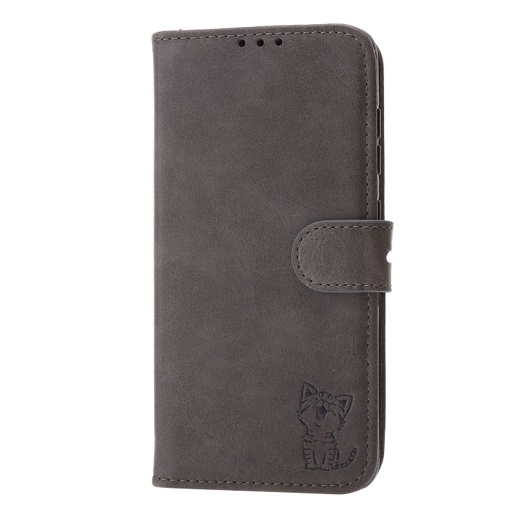 Grey leather flip phone case with cat emblem and magnetic strap closure