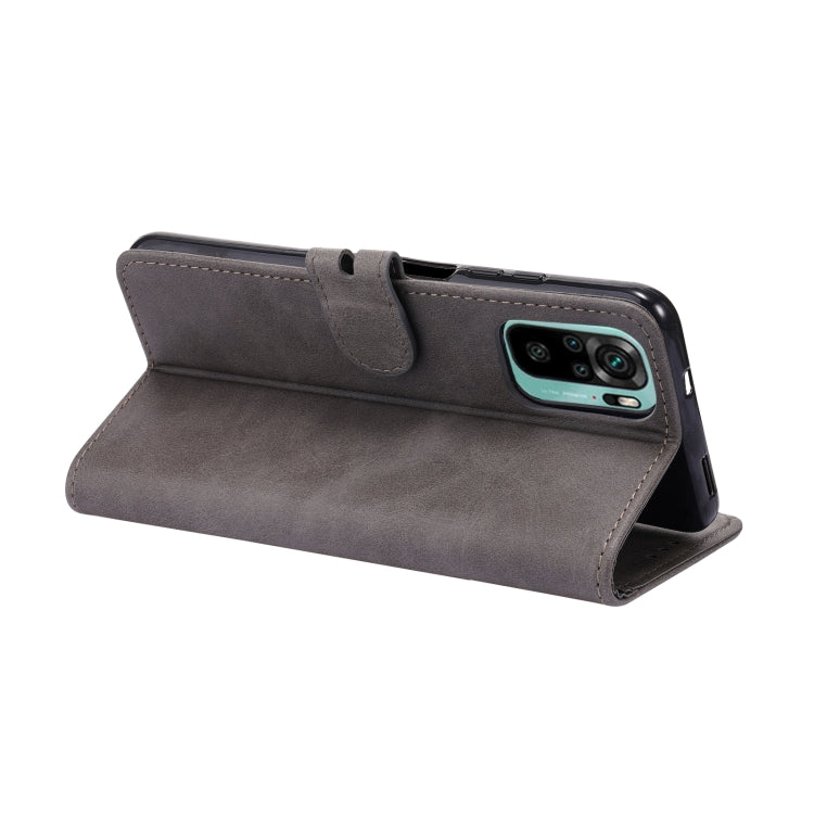 Grey leather flip phone case with wallet-style fold and magnetic closure