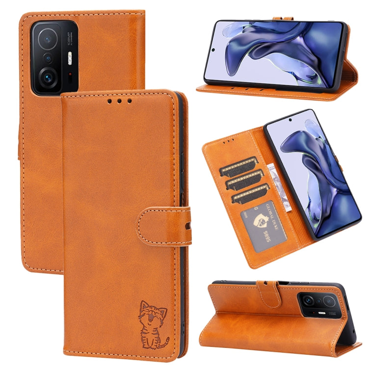 Orange leather flip phone case with embossed cat, card slots, and stand holder