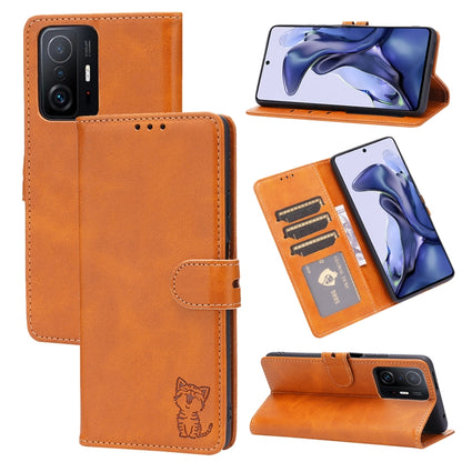 Orange leather flip phone case with embossed cat, card slots, and stand holder