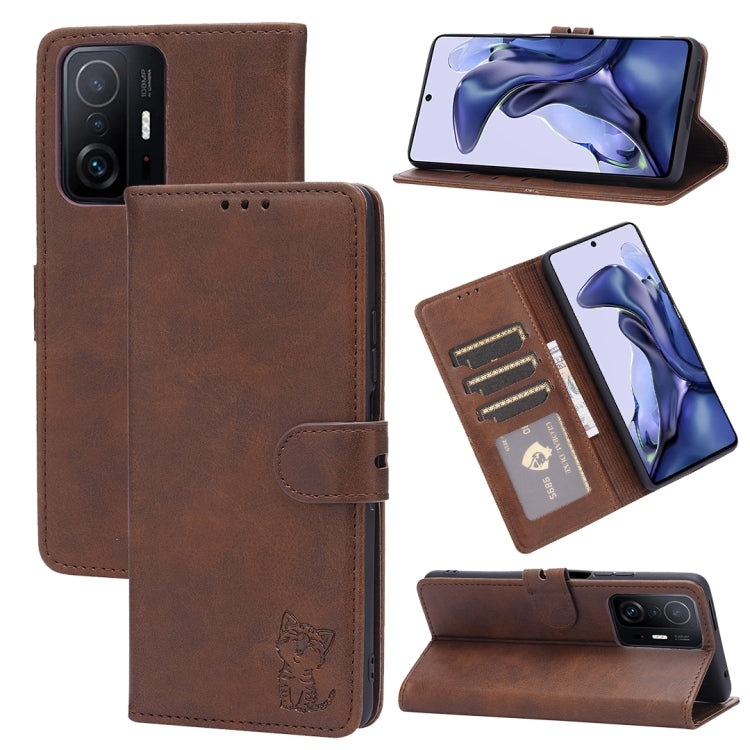 Brown leather flip phone case with embossed cat, card slots, and stand holder