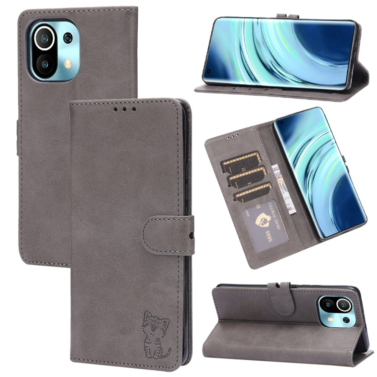 Light grey leather flip phone case with embossed cat, card slots, and stand holder