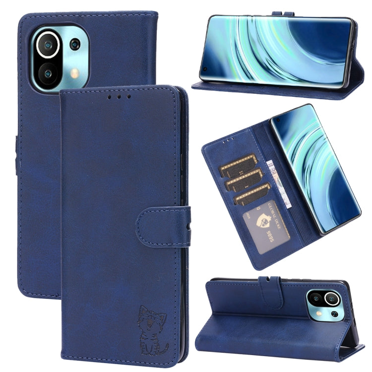 Blue leather flip phone case with embossed cat, card slots, and stand holder