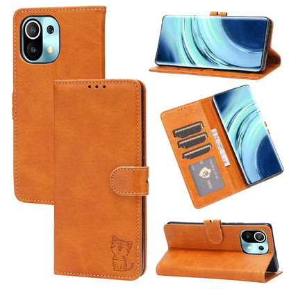 Orange leather flip phone wallet case with embossed cat, card slots, and stand holder