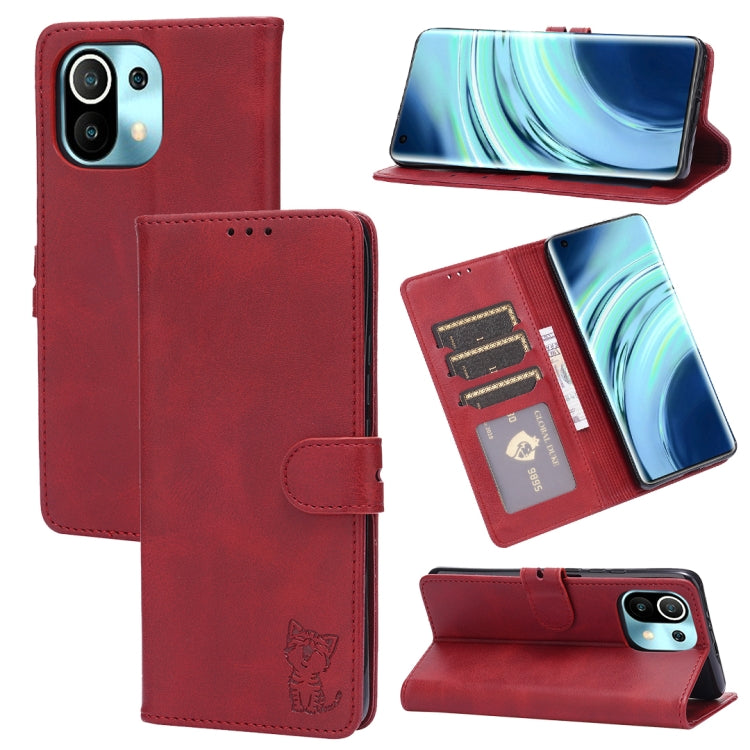 Red leather flip phone wallet case with embossed cat, card slots, and stand holder