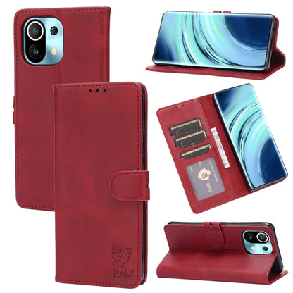 Red leather flip phone wallet case with embossed cat, card slots, and stand holder