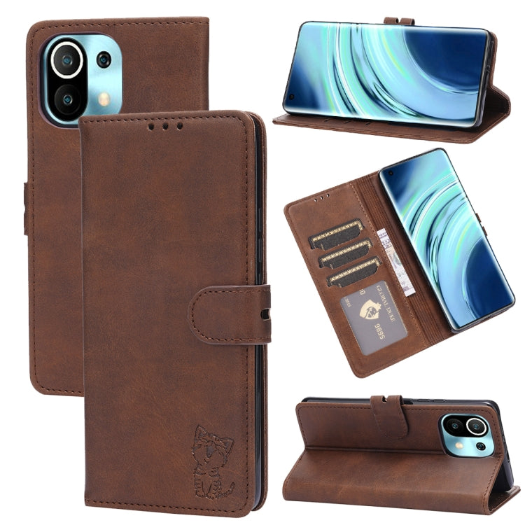 Brown leather flip phone wallet case with embossed cat, card slots, and stand holder