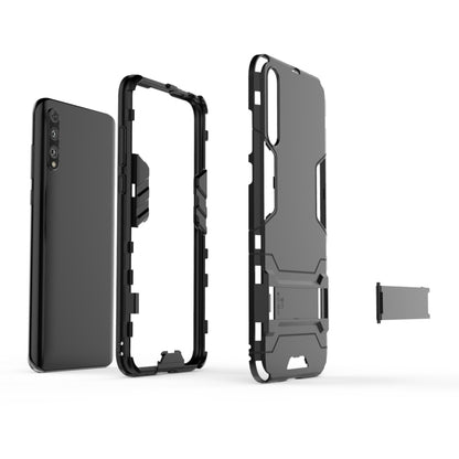 Rugged shockproof phone case in dark gray, open-frame design with camera cutout
