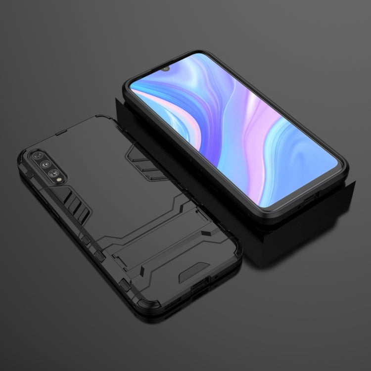 Rugged shockproof phone case in black, close view of side protection and buttons