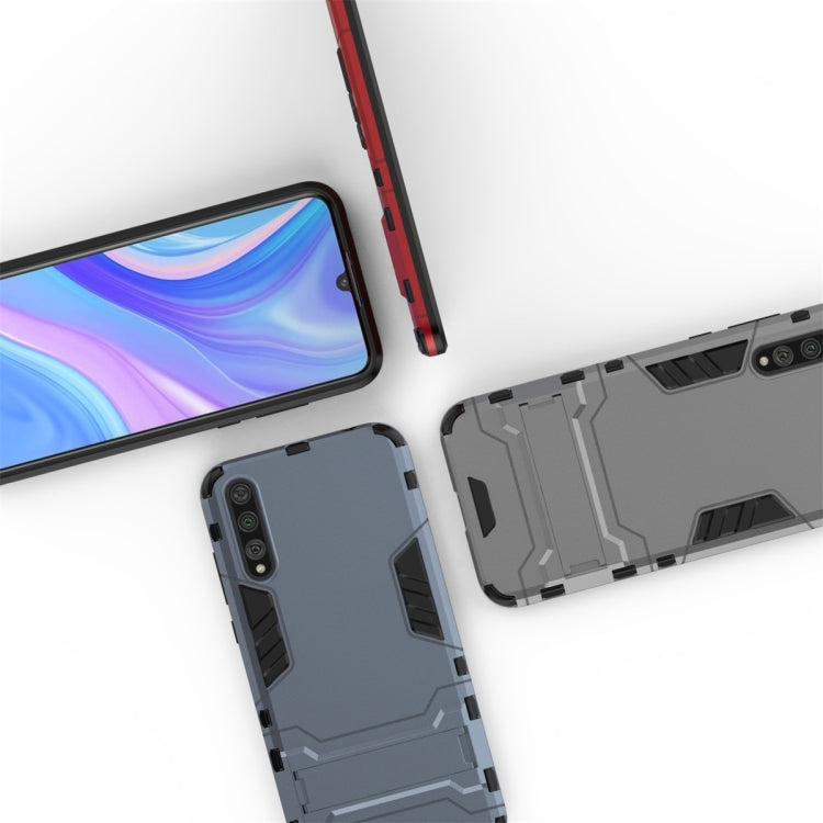 Rugged shockproof phone case in dark gray, shown with red phone edge and back