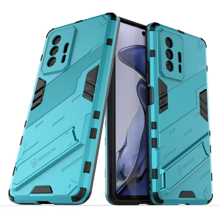 Teal armored 2-piece shockproof phone case with raised camera cutouts