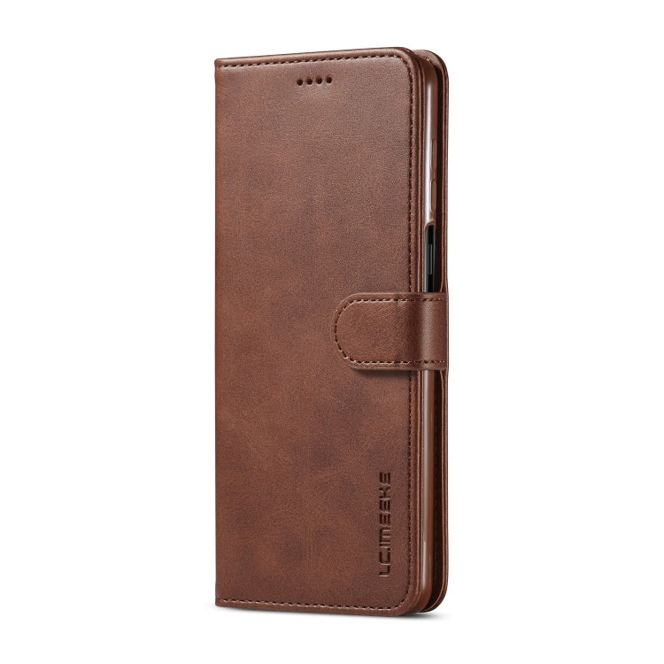 Brown textured leather flip phone case with front pocket and camera cutout
