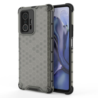 Dark honeycomb shockproof phone case with rugged bumper, raised corners, camera cutouts.