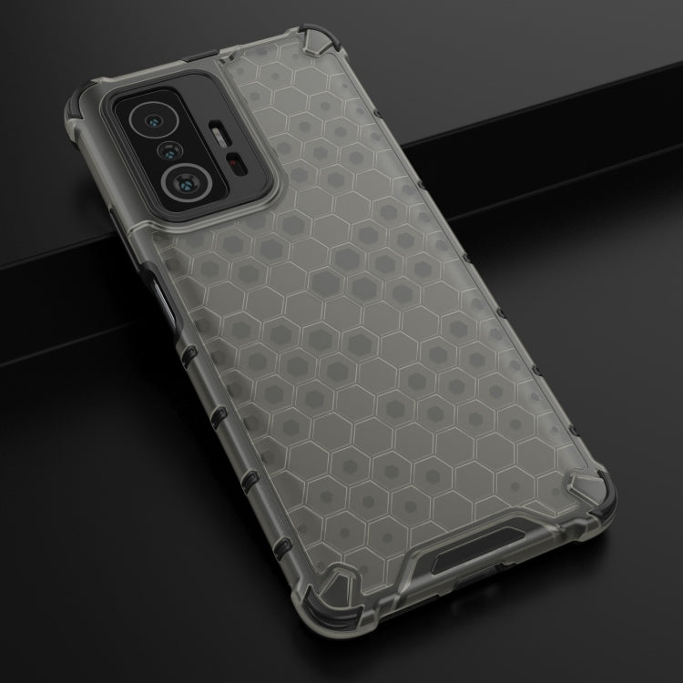 Light gray honeycomb shockproof phone case with rugged bumper and side button cutouts.