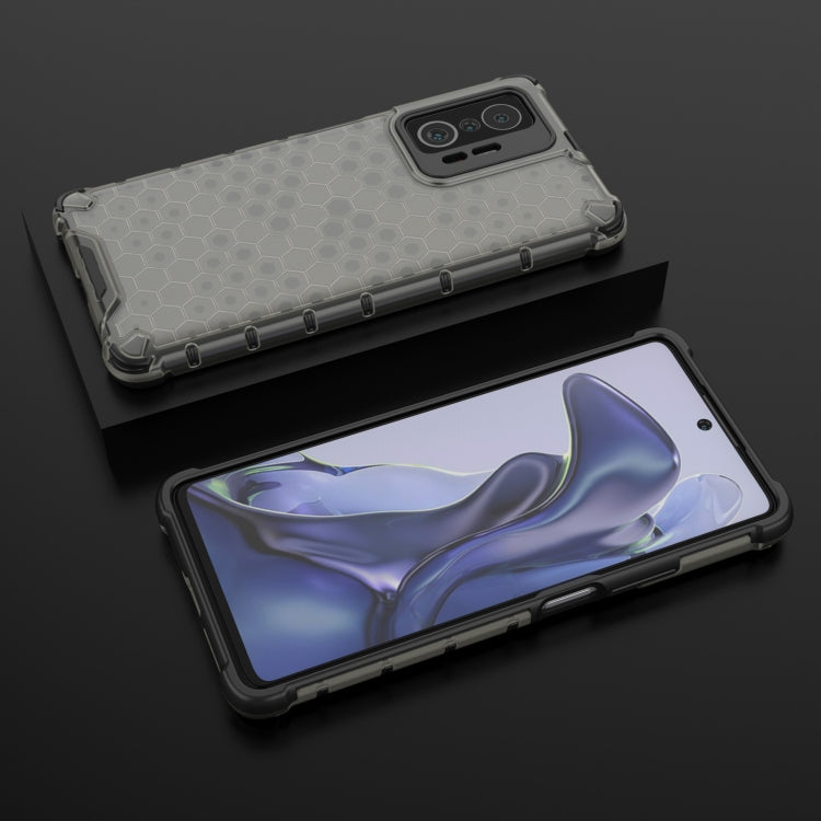Light gray honeycomb shockproof phone case with bumper edges and camera opening.