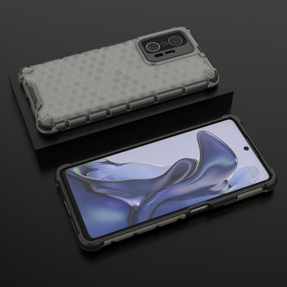Light gray honeycomb shockproof phone case with bumper edges and camera opening.