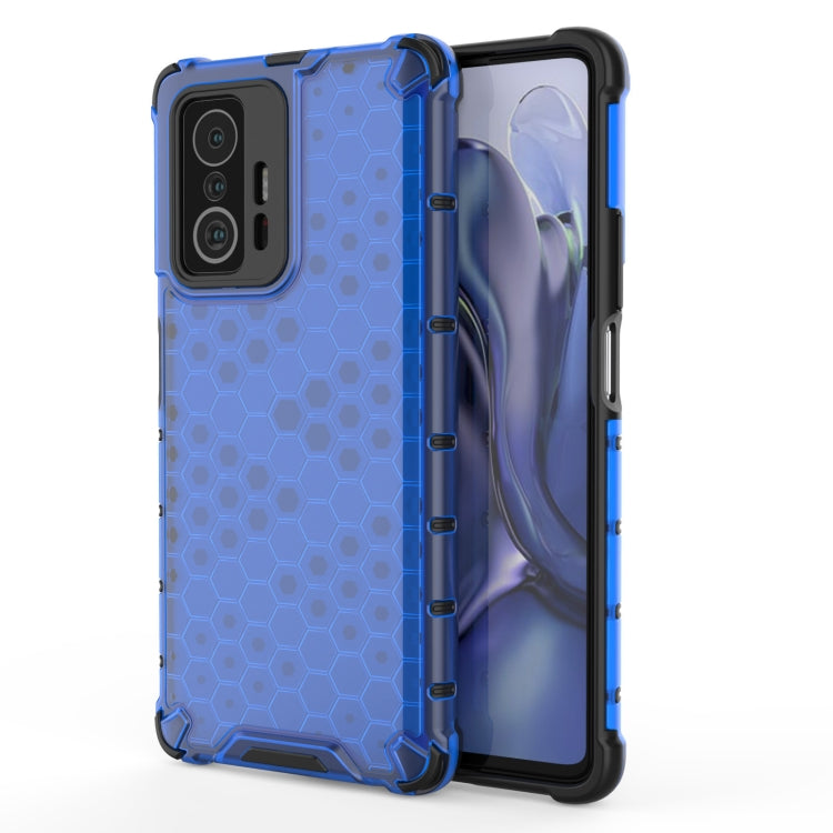 Blue honeycomb shockproof phone case with rugged bumper and side port cutouts.