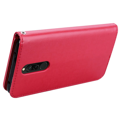 Red flip phone case with embossed rose design and camera cutout