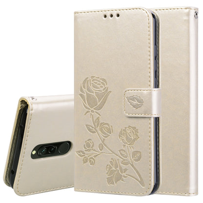Beige rose-embossed wallet flip phone case with card slots and magnetic closure