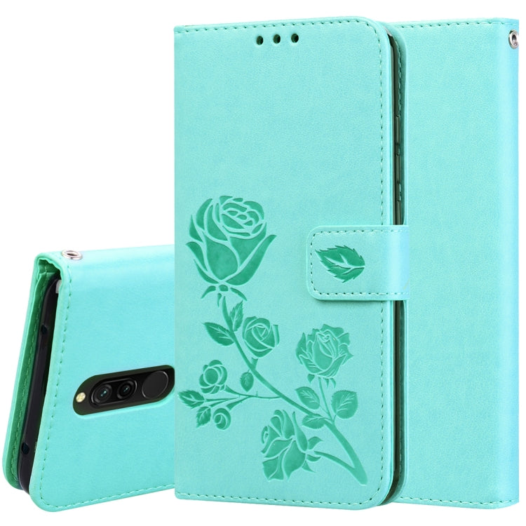 Teal rose-embossed wallet flip phone case with card slots and magnetic closure