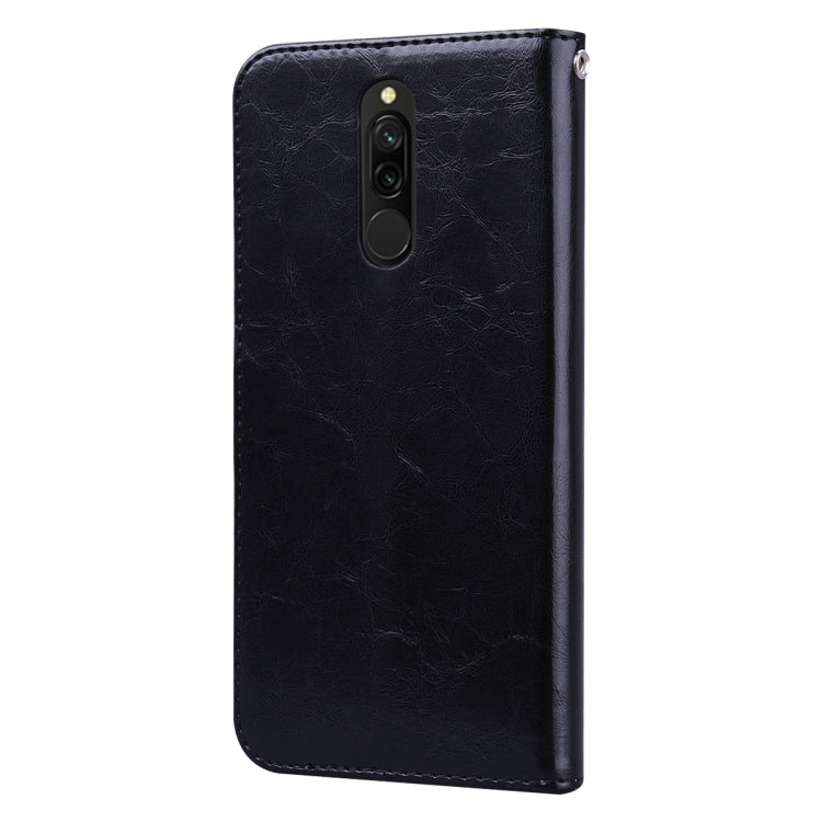 Black leather flip phone case with camera cutout and top speaker openings