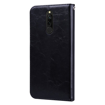 Black leather flip phone case with camera cutout and top speaker openings