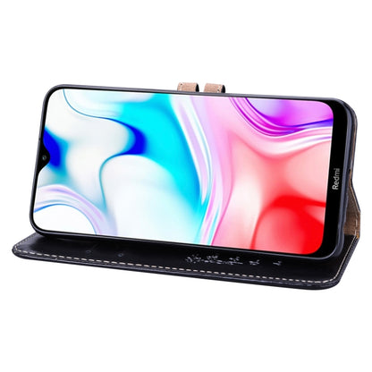 Black leather flip wallet case on phone with cutouts for ports and speaker