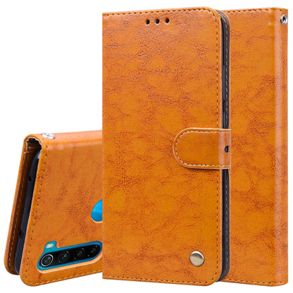 Orange flip leather phone wallet case with card slot pocket and magnetic snap, textured finish