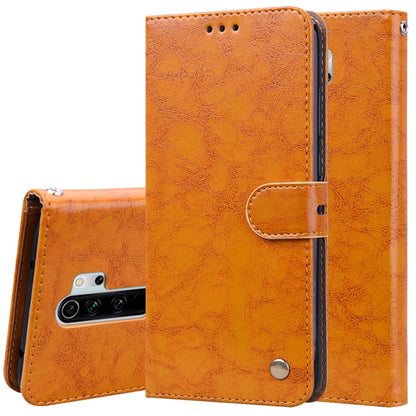 Orange flip leather wallet phone case with card holder and magnetic closure.