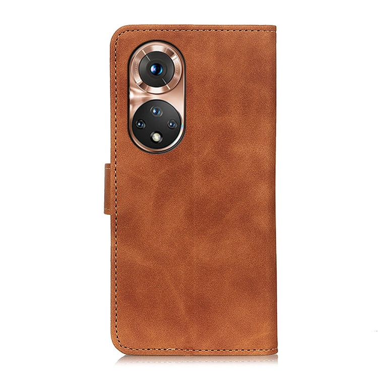 Brown leather flip phone case with dual-camera cutout and stitched edges
