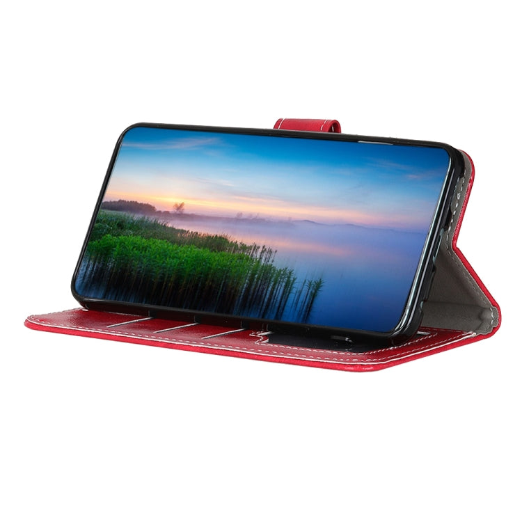 Red leather flip folio phone case propped up for hands-free viewing