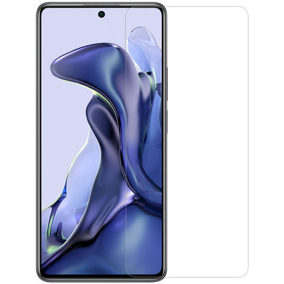 Clear tempered glass screen protector film for a smartphone, full front coverage