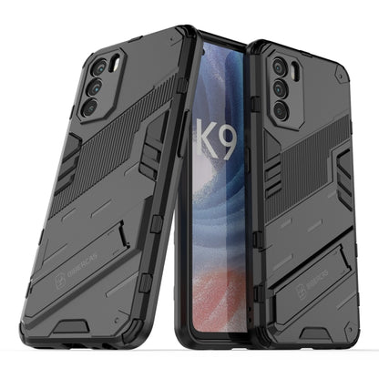 Rugged black phone case with textured grip, raised edges, and dual-layer protection